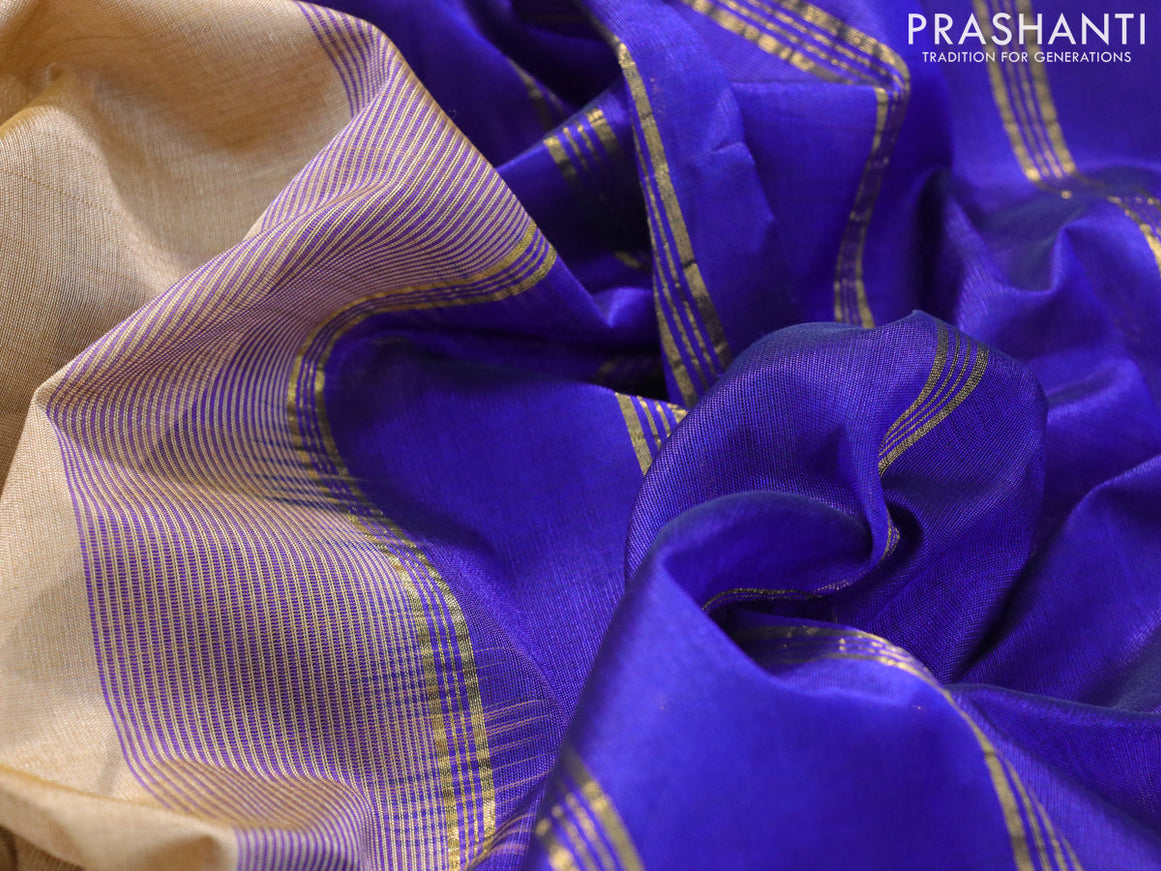 Silk cotton saree dark sandal and blue with plain body and small zari woven border