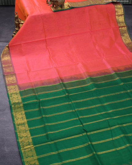 Silk cotton saree dual shade of pinkish orange and green with plain body and annam zari woven border