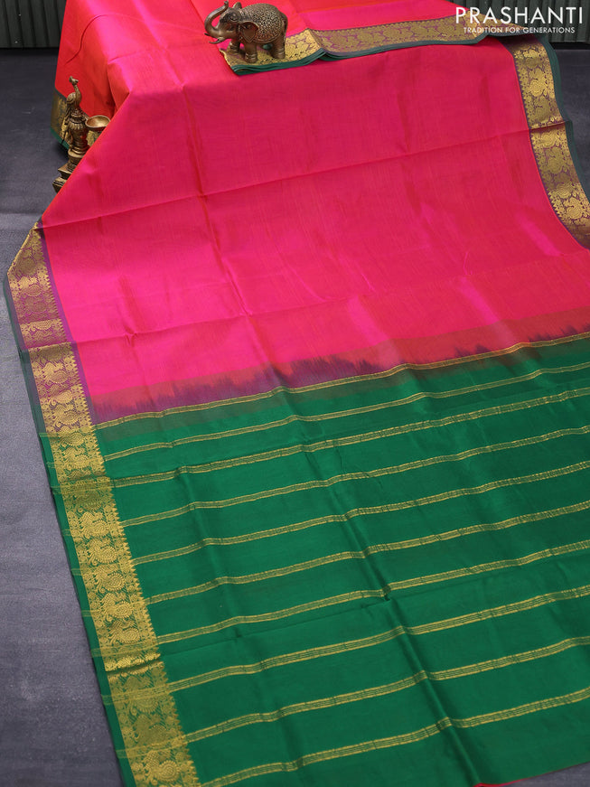 Silk cotton saree dual shade of pinkish orange and green with plain body and annam zari woven border