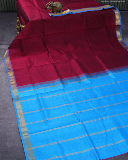 Silk cotton saree dark magenta pink and cs blue with plain body and small zari woven border