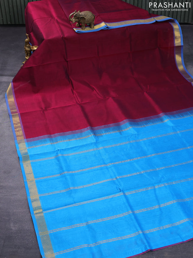Silk cotton saree dark magenta pink and cs blue with plain body and small zari woven border