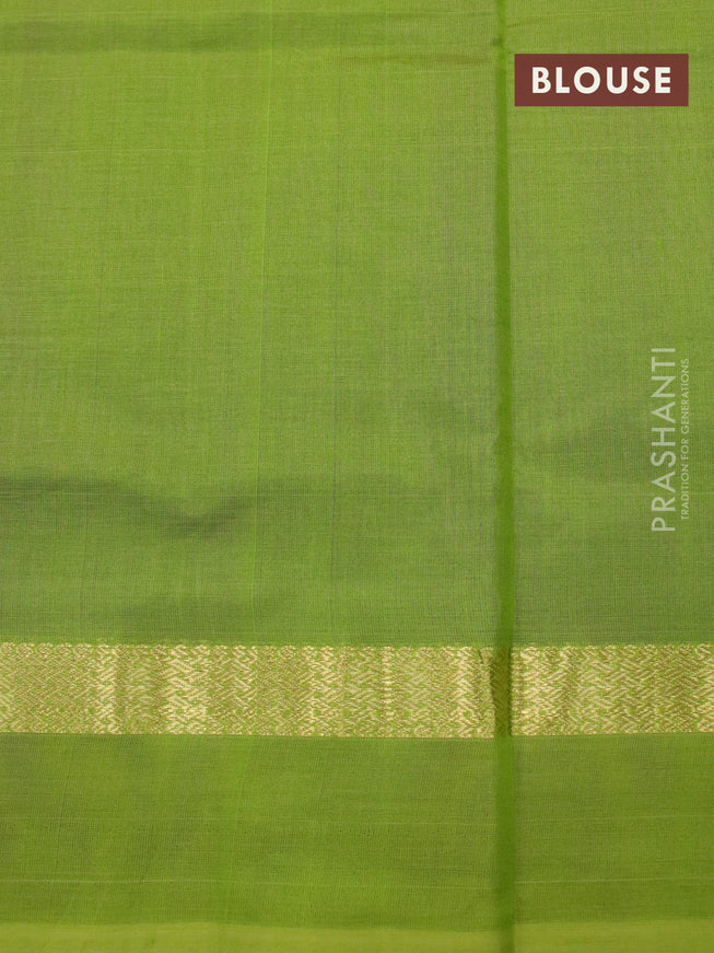 Silk cotton saree deep purple and light green with plain body and zari woven simple border