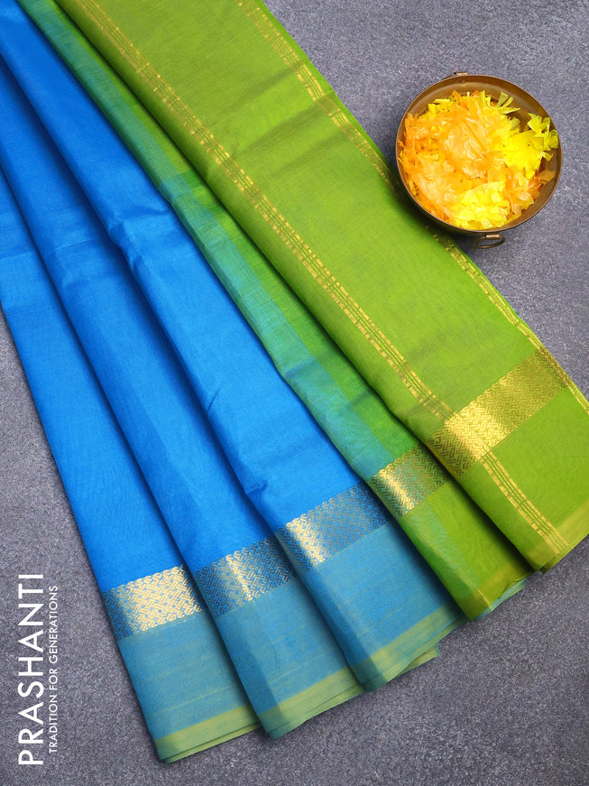 Silk cotton saree light blue and green with plain body and zari woven simple border