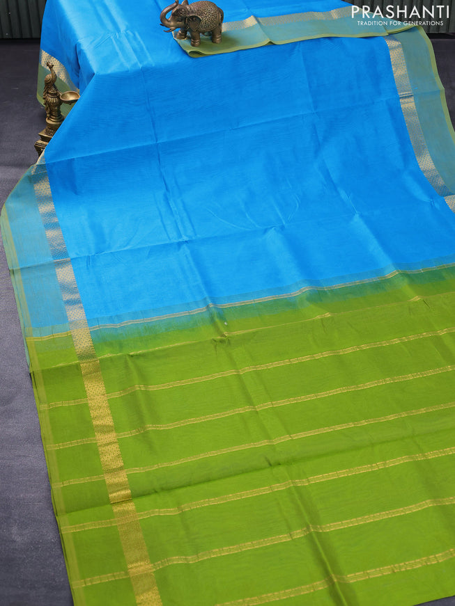 Silk cotton saree light blue and green with plain body and zari woven simple border