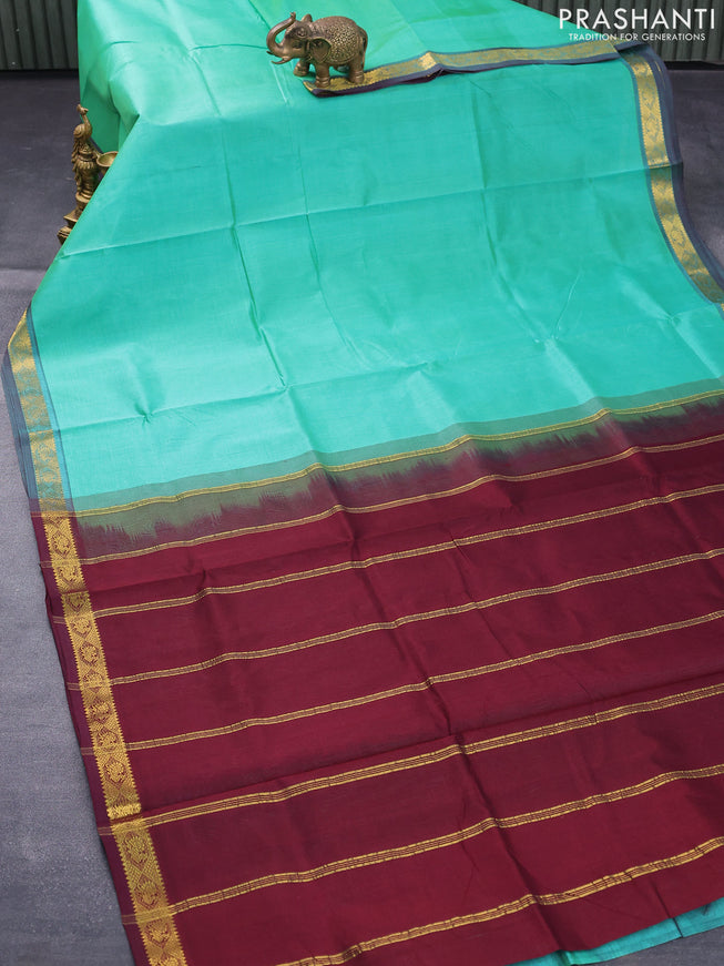 Silk cotton saree teal green and deep maroon with plain body and small zari woven border