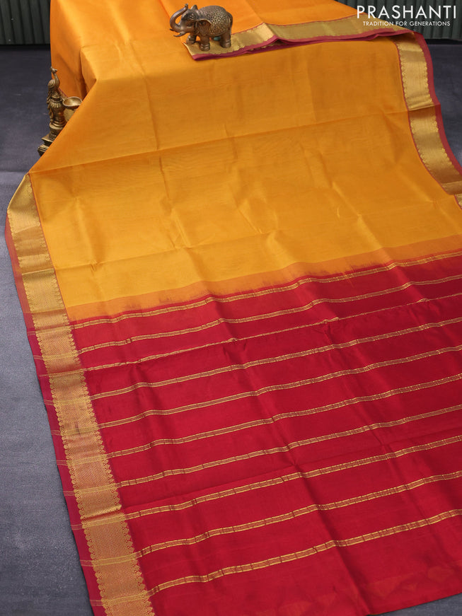 Silk cotton saree mango yellow and maroon with plain body and zari woven border