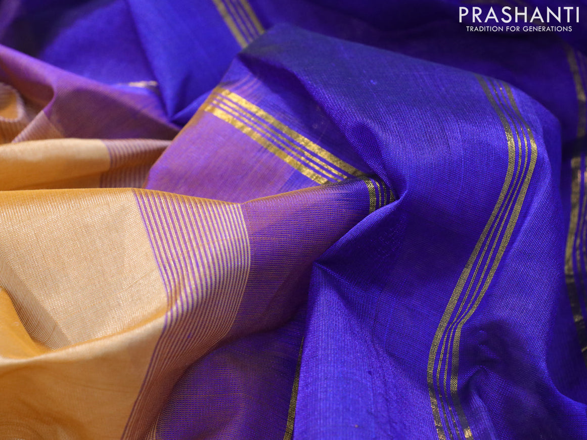 Silk cotton saree sandal and blue with plain body and small zari woven border
