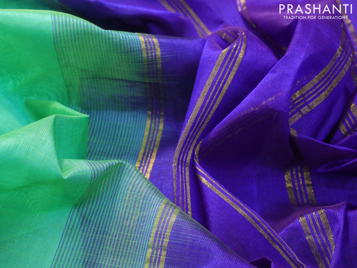 Silk cotton saree teal green and blue with plain body and zari woven border