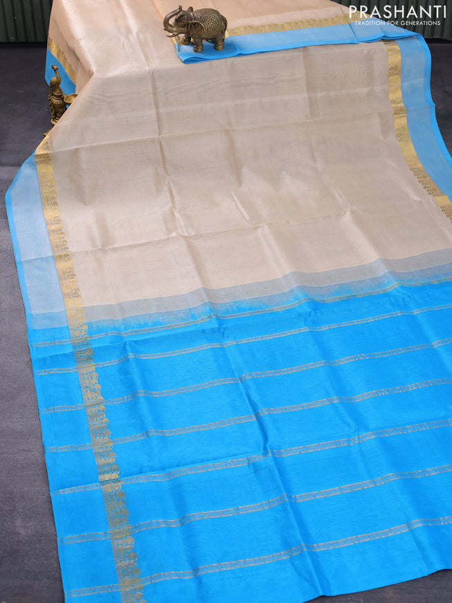 Silk cotton saree cream and light blue with plain body and zari woven simple border