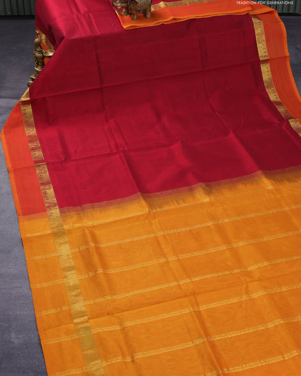 Silk cotton saree maroon and mustard yellow with plain body and zari woven simple border