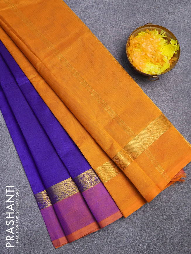 Silk cotton saree blue and mustard yellow with plain body and zari woven simple border