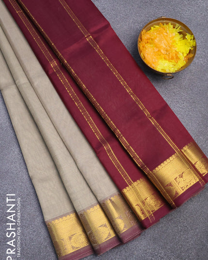 Silk cotton saree pastel grey and deep wine shade with plain body and zari woven border