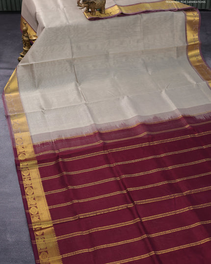 Silk cotton saree pastel grey and deep wine shade with plain body and zari woven border