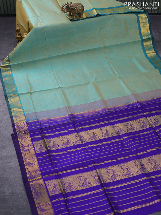 Silk cotton saree dual shade of teal blue and blue with plain body and zari woven border