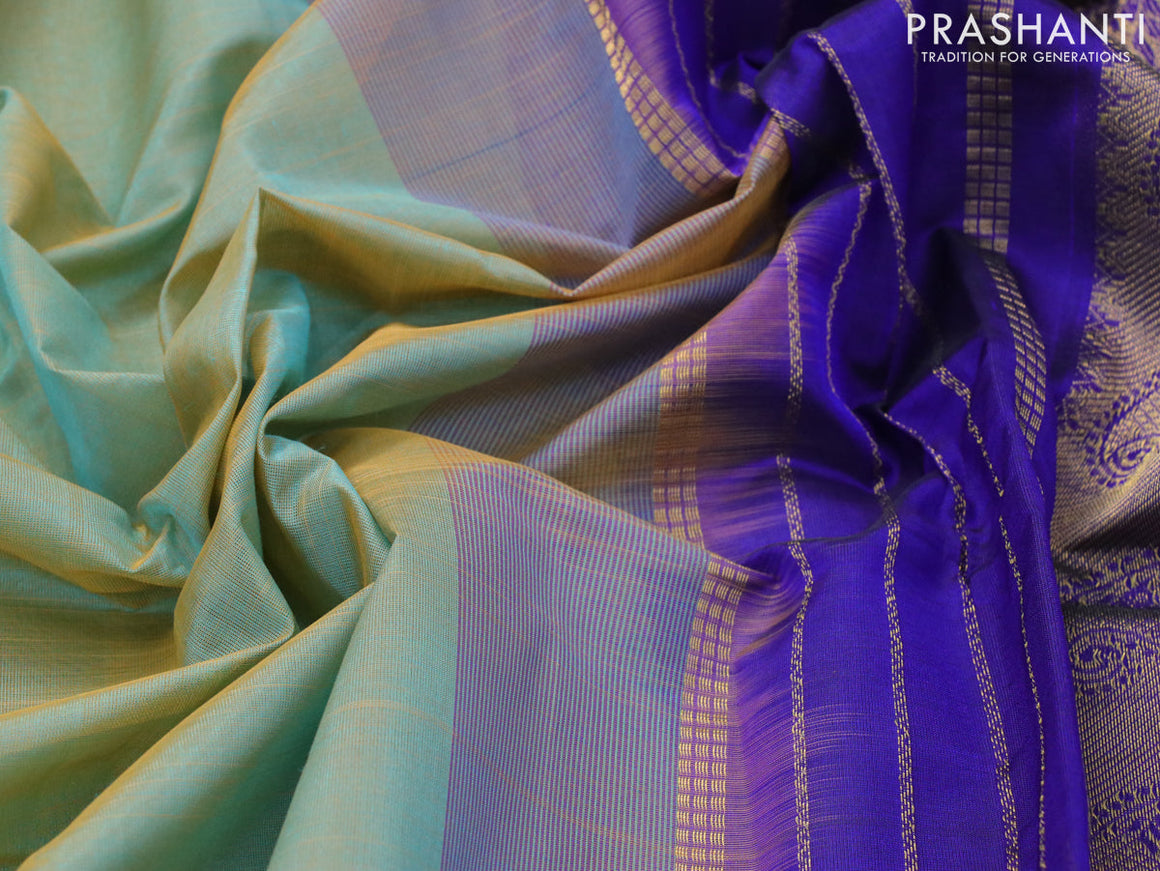 Silk cotton saree dual shade of teal blue and blue with plain body and zari woven border