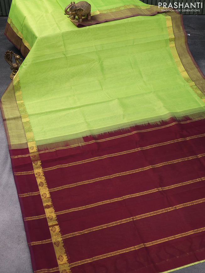 Silk cotton saree light green and wine shade with plain body and zari woven simple border