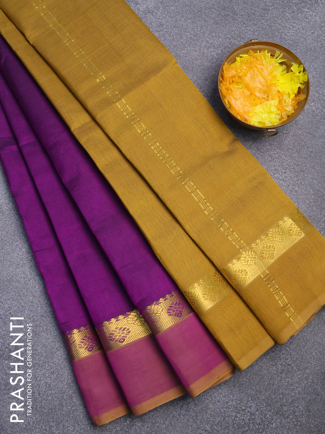 Silk cotton saree purple and mehendi green with plain body and zari woven simple border