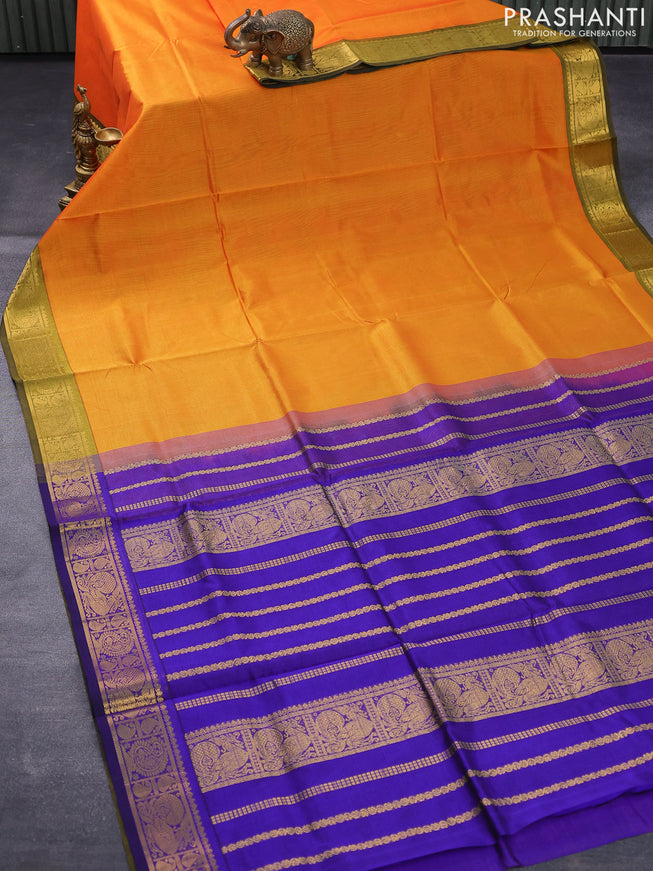 Silk cotton saree dual shade of mustard yellow and blue with plain body and zari woven border