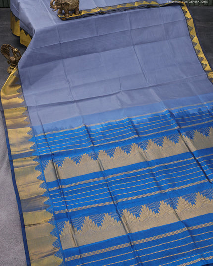 Silk cotton saree pastel grey and cs blue with plain body and temple design zari woven border