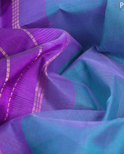Silk cotton saree dual shade of green and violet with plain body and temple design zari woven border