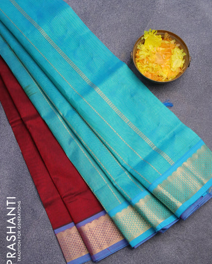 Silk cotton saree maroon and teal blue shade with plain body and zari woven border