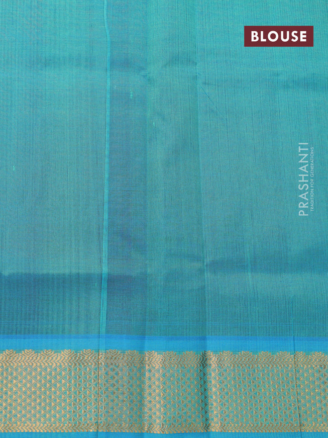Silk cotton saree maroon and teal blue shade with plain body and zari woven border