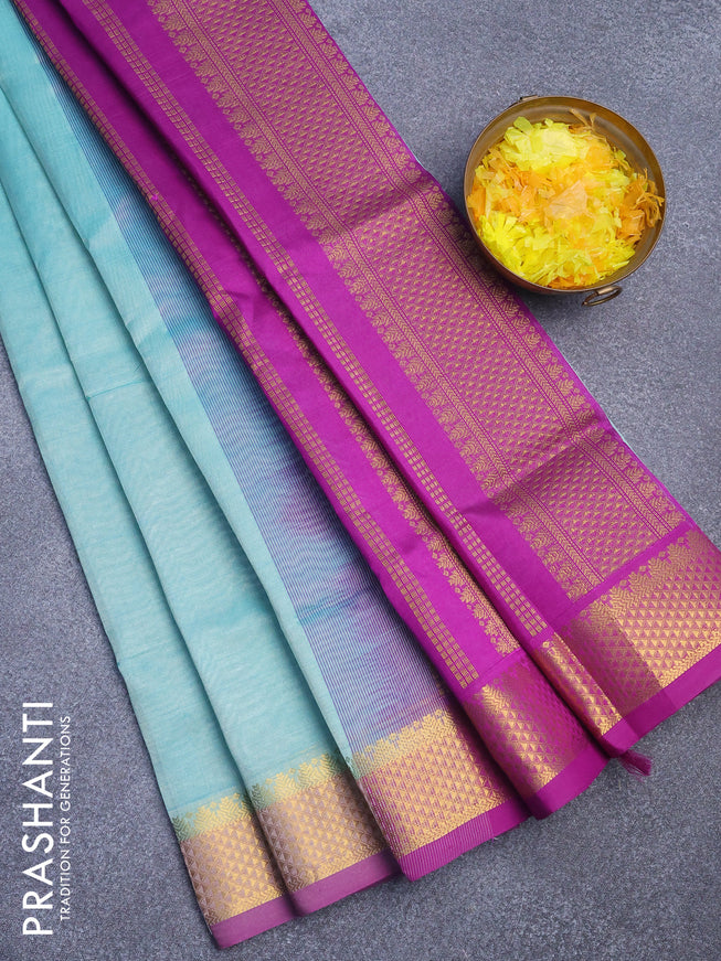 Silk cotton saree teal blue shade and purple with plain body and zari woven border