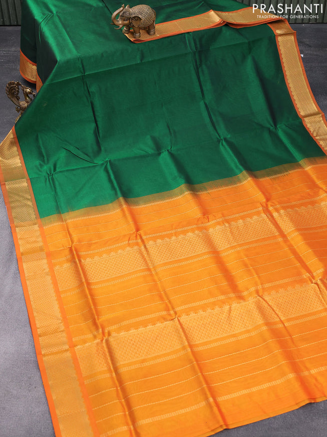 Silk cotton saree green green and orange with plain body and zari woven border