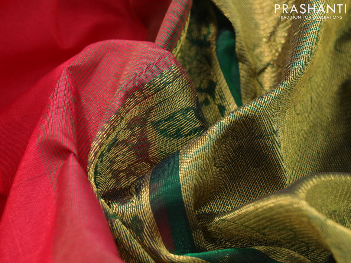 Silk cotton saree red and bottle green with plain body and zari woven border