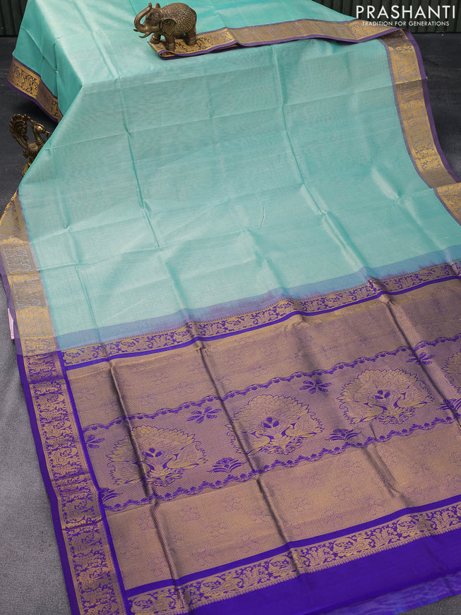 Silk cotton saree teal blue shade and blue with plain body and zari woven border