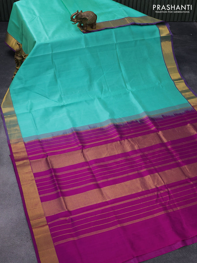 Silk cotton saree teal shade and purple with plain body and zari woven border