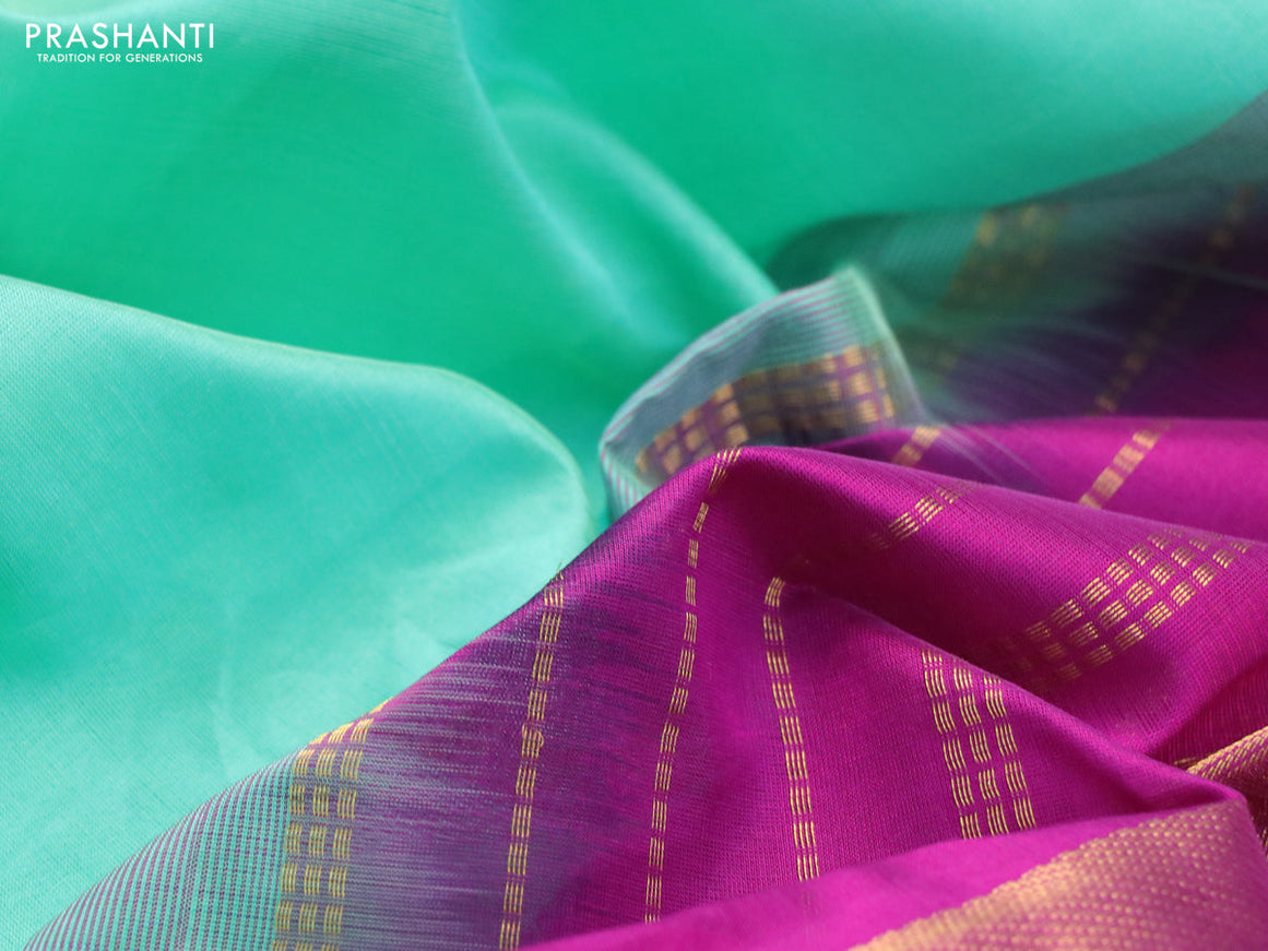 Silk cotton saree teal shade and purple with plain body and zari woven border