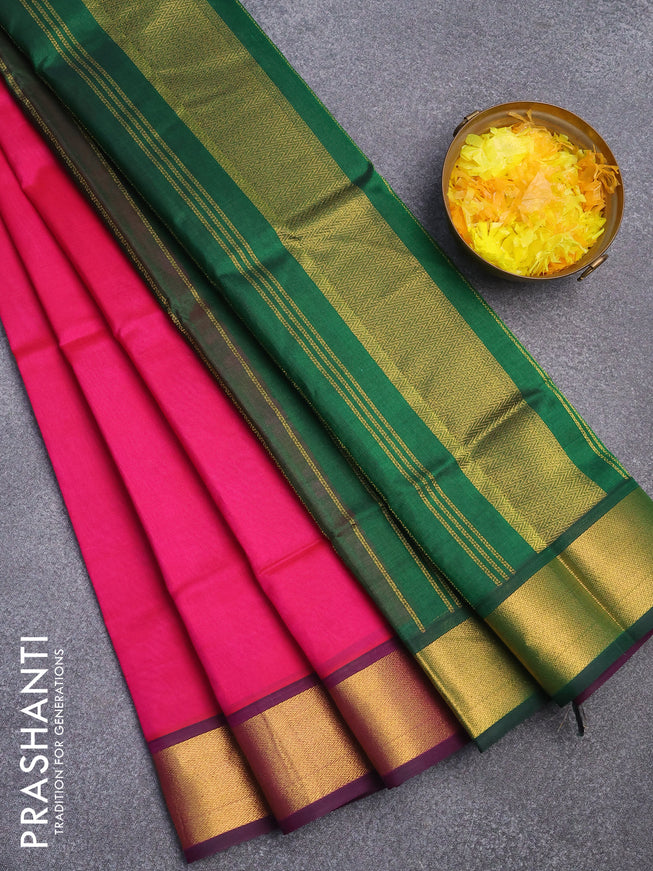 Silk cotton saree pink and dark green with plain body and zari woven border