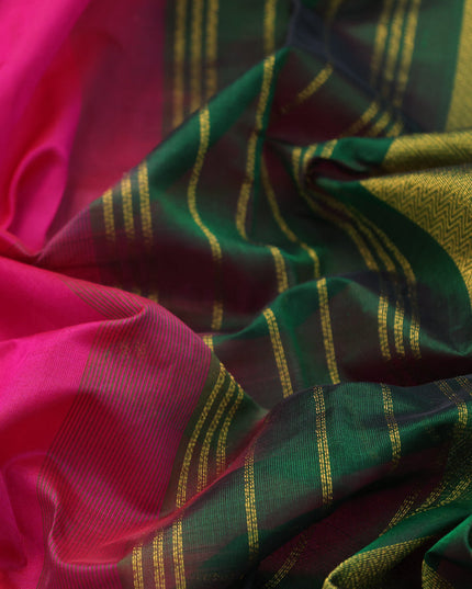 Silk cotton saree pink and dark green with plain body and zari woven border