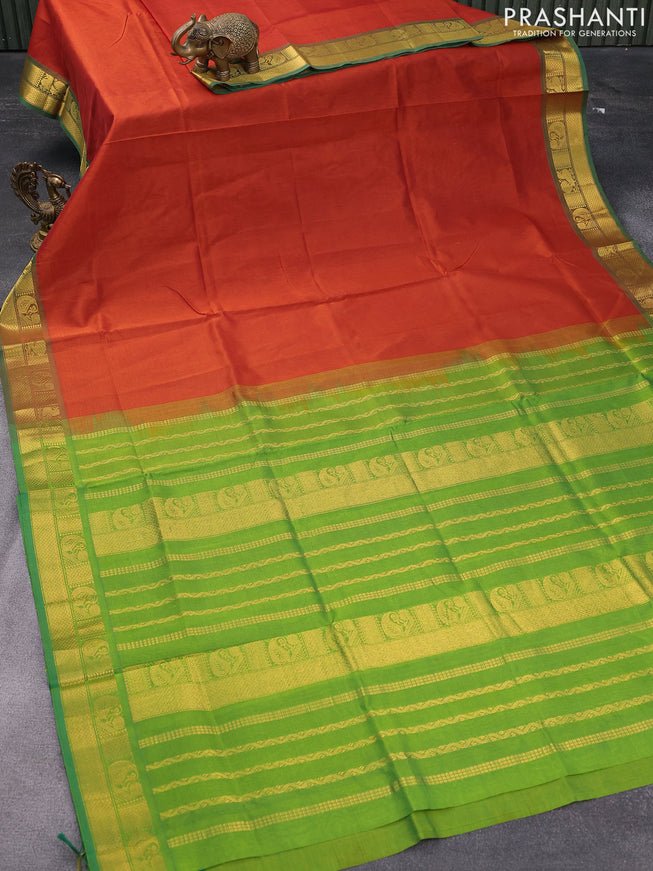 Silk cotton saree rust shade and green with plain body and zari woven border