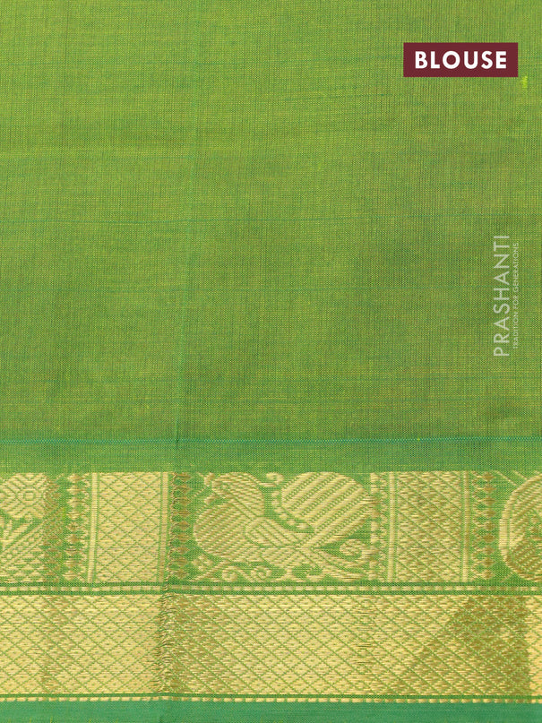 Silk cotton saree rust shade and green with plain body and zari woven border