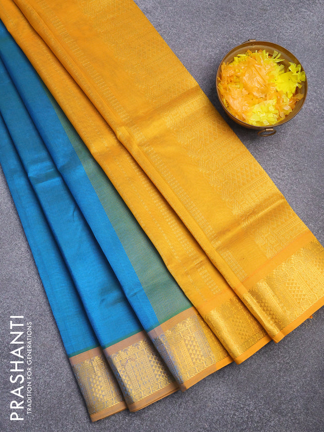 Silk cotton saree dual shade of teal blue and mustard yellow with plain body and zari woven border