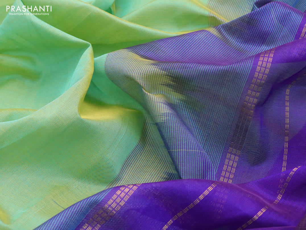 Silk cotton saree dual shade of green and blue with plain body and temple design zari woven border