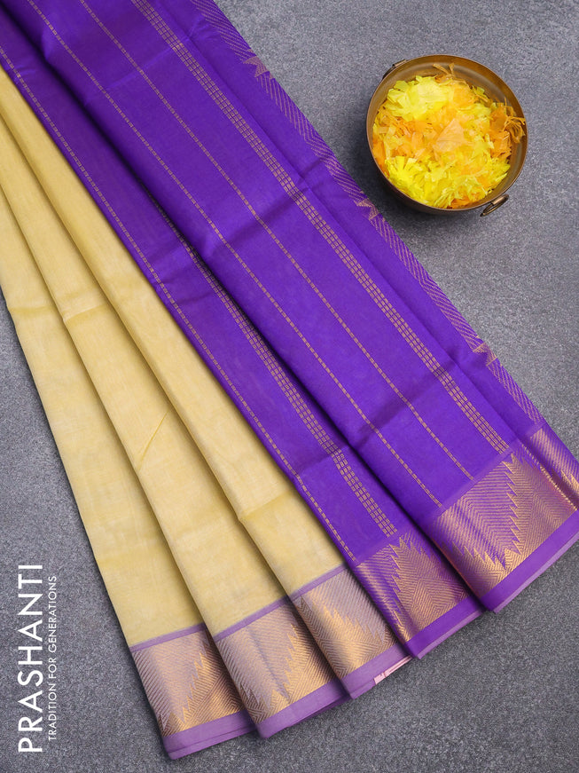 Silk cotton saree pale yellow and violet with plain body and temple design zari woven border