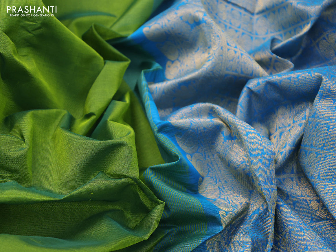 Silk cotton saree green and cs blue with plain body and zari woven border