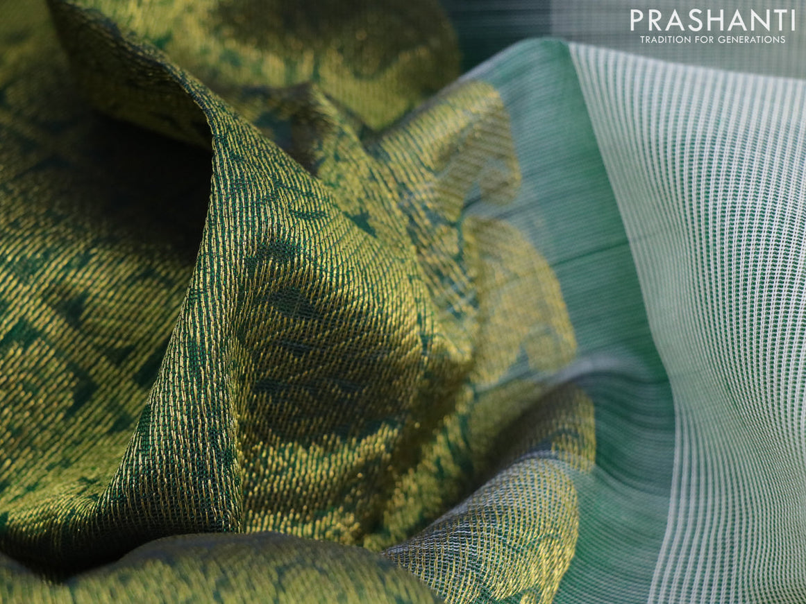 Silk cotton saree off white and green with plain body and zari woven border