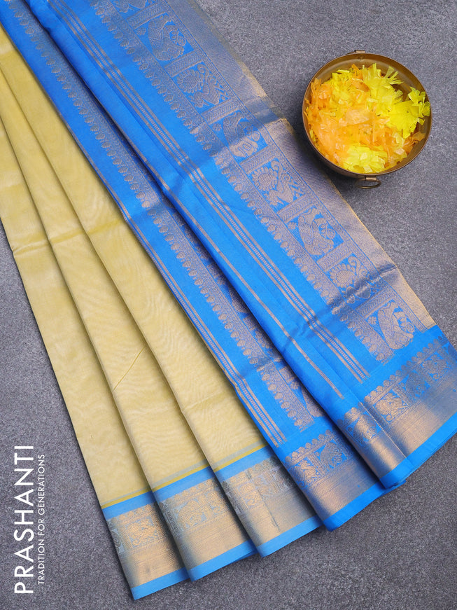 Silk cotton saree pale yellow and cs blue with plain body and zari woven border