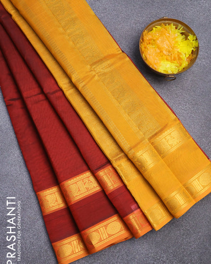 Silk cotton saree maroon and mustard yellow with plain body and rettapet zari woven border