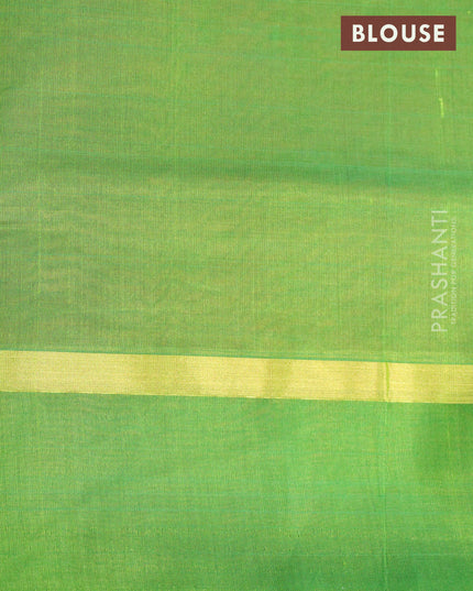 Silk cotton saree rust shade and light green with plain body and zari woven simple border