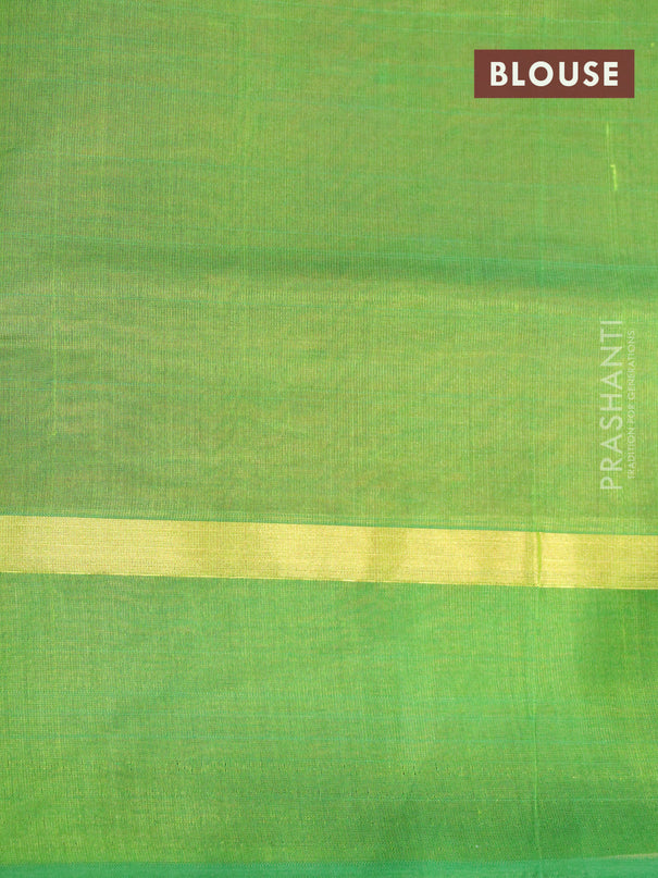 Silk cotton saree rust shade and light green with plain body and zari woven simple border