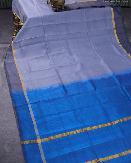 Silk cotton saree grey and peacock blue with plain body and zari woven simple border