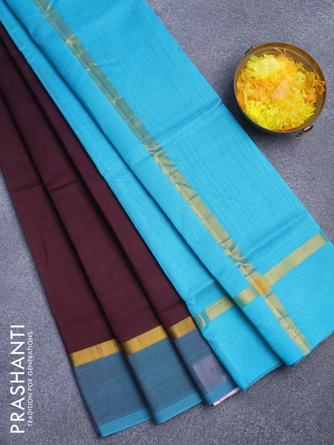 Silk cotton saree coffee brown and teal blue with plain body and zari woven simple border
