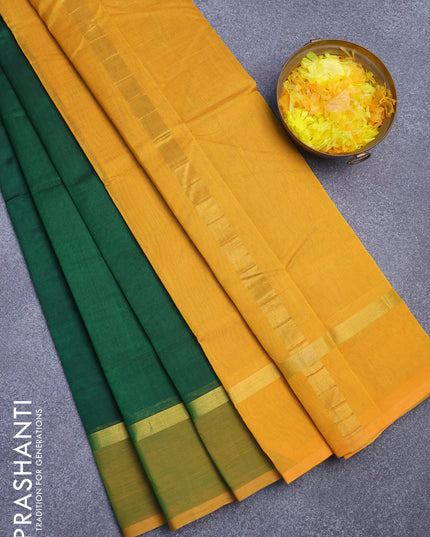 Silk cotton saree green and mustard yellow with plain body and zari woven simple border