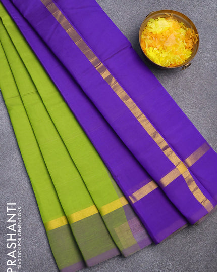Silk cotton saree light green and blue with plain body and zari woven simple border