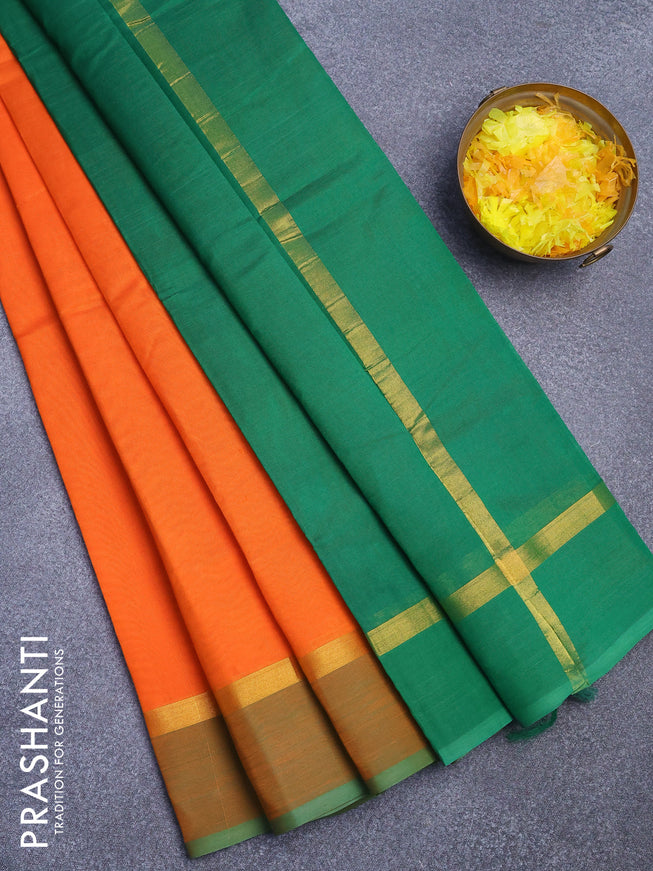 Silk cotton saree orange and green with plain body and zari woven simple border